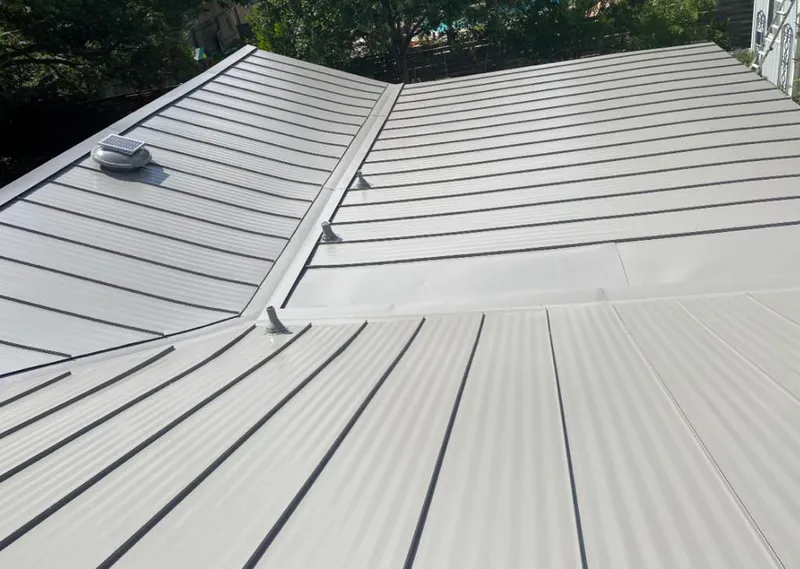 Solar attic fan installed on a metal roof for Roof Ventilation in Sparks